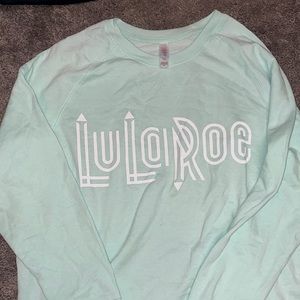 teal crewneck with white lettering